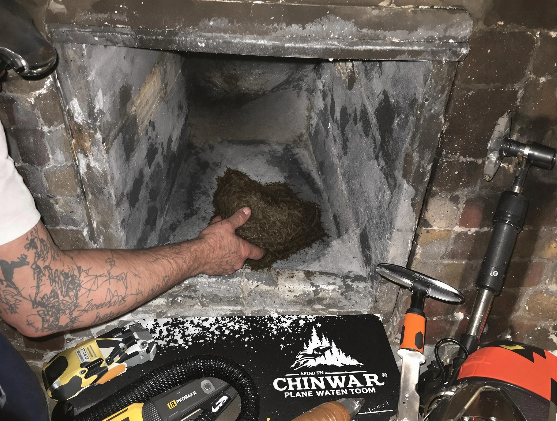Powder Springs Chimney Sweep safely removing debris and screening chimney in Powder Springs, GA